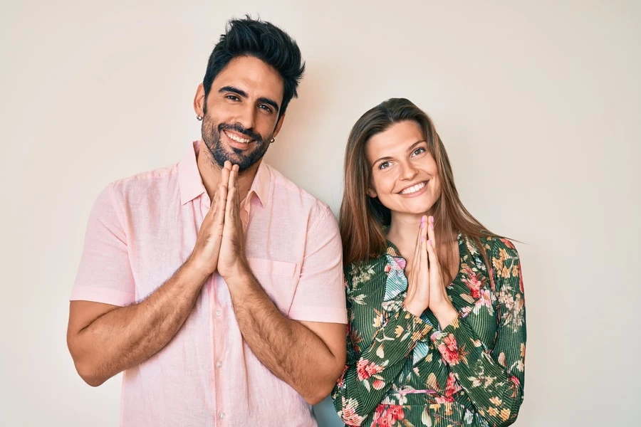 Couple posing with prayer hands