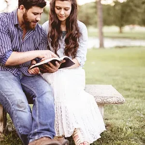 Man and Woman in White Dress Reading Bible - FarmersOnly