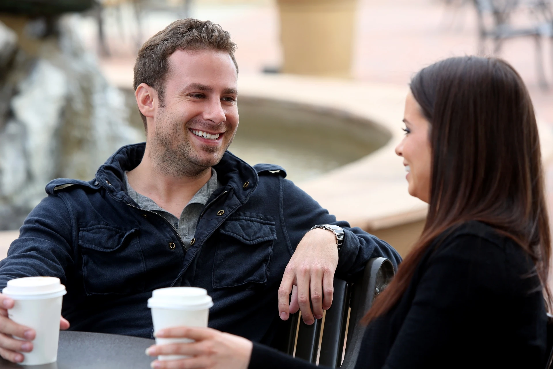 Young couple drinking coffee on a first date